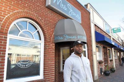 Tambo Barrow hopes to be a “burger innovator” in Lower Mills. 	Photo by Bill Forry